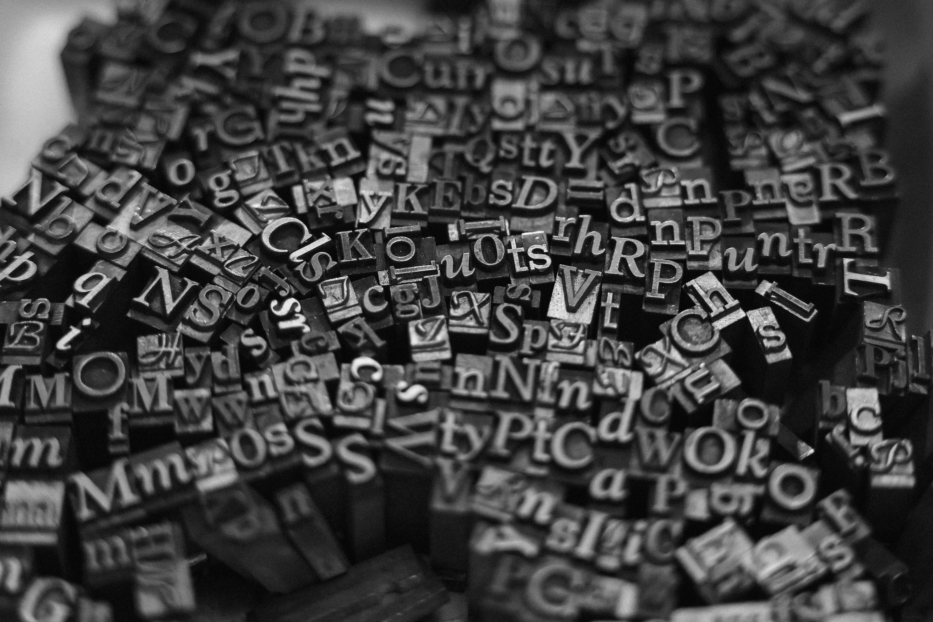 Close-up of hand-set metal type on a composing frame.